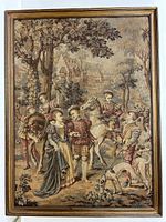 Full view of framed old French tapestry showing six figures in Renaissance clothing in an outdoor setting with trees and buildings in background.
