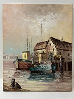 Full view of the oil on canvas painting showing harbour scene with boats and dock buildings under cloudy sky.