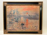 Full view of the framed impressionistic painting 'Sunrise' showing water, boats, and industrial background with a vivid sunrise, surrounded by a gold and black ornamental frame.