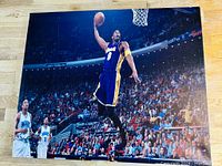 Wide shot of the canvas photo showing Kobe Bryant mid-air in a basketball arena with crowd.