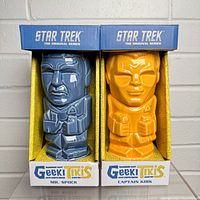 Front-facing view of new boxed Star Trek Geeki Tiki mugs with Mr. Spock (blue) and Captain Kirk (orange).