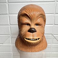 Front view of the closed Chewbacca plastic head playset showing detailed molded fur and painted eyes, nose, and mouth.