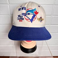Front view of the vintage 1993 Toronto Blue Jays World Series baseball cap on mannequin head, showing embroidered front details