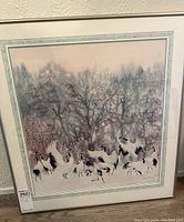 Framed watercolour art with cranes in winter setting, showing full artwork and frame.