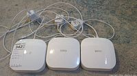 Three Eero units front view with cables