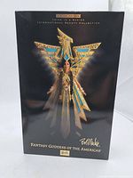 Front of the box showing the Barbie doll in costume with name and series details