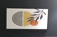 Black framed abstract botanical art print with MCM-inspired geometric and organic shapes on light background.