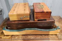 View showing all four items - dark wooden tray with green trim and three wooden boxes on top of it