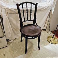 Front view of chair showing curved backrest and seat