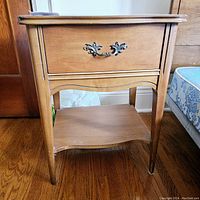 Front view of the nightstand showing overall structure and finish