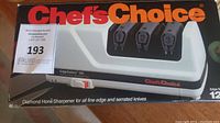 Front box showing the Chef's Choice logo, model name EdgeSelect 120, and the sharpener device with three slots visible.