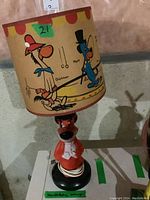 Full view of Huckleberry Hound lamp including lampshade with characters Quickdraw and Huckleberry Hound