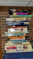 Stack of board games showing titles and box conditions.