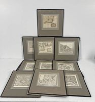 Overall group of 10 maps arranged on table showing frames and mats
