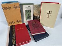 Six Folio Society books displayed together showing variety of cover colors and designs.
