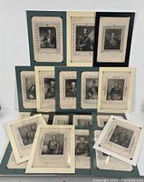 Front view of all 20 military portrait engravings arranged upright and spread out, showing decorative borders and black and white images of various military officers.