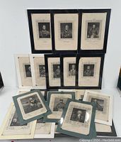 Group view of majority of military portrait engravings laid out showing framing and backing color variety.