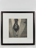 Frontal photograph of framed Etienne Delessert print showing the entire artwork inside a dark frame with white mat.