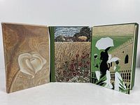 Inside front cover illustrations of the three books.