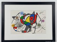 Full view of mounted and framed lithograph showing abstract colored shapes and black linework, white mat and black frame