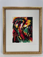 Framed lithograph showing entire artwork with gold ornamental frame and white mat board.