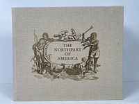 Front cover of the book showing cloth bound cover with gold ink illustration and title.