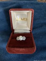 Ring in Zales jewelry box on blue cloth background