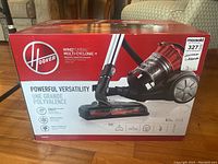 Front of sealed vacuum box showing Hoover logo, model name, and key features