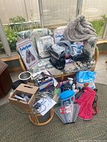 Overview of all grooming tools and accessories laid out on sofa and glass table