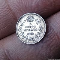 Reverse of the coin showing denomination '5 CENTS CANADA 1919' with crown and maple wreath.