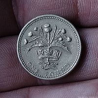Reverse side of the coin showing crowned thistle design with denomination.