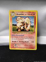 Front photo of an Arcanine Pokémon card showing image, text, and attack stats.