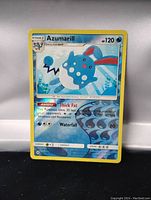 Single Azumarill Stage 1 Pokemon card with reverse holo foil finish, shown upright against neutral background.