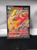 Front image of Blaziken V R-Strike holo foil Pokemon card, showing card details, attacks, HP, and artwork.