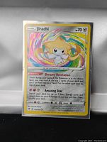 Front view of Jirachi Holo Foil Pokemon Card showing artwork, stats, and abilities