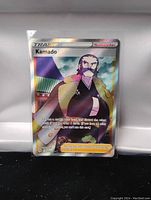 Clear photo of a full art Kamado Pokémon Trainer card in a protective sleeve to showcase condition and details.