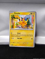 Front view of a Pikachu Pokemon trading card, showing the card artwork, stats, and text clearly.