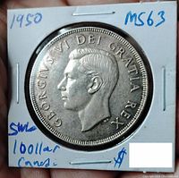 Obverse of 1950 Canadian silver dollar coin showing King George VI with inscription and grading noted as MS63.