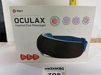 Front view of the Lifepro Oculax Heated Eye Massager box showing product image, logo, and features.