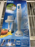 Front side of the original box showing the handblender, food processor bowl, and whisk attachment with 200 watt power label