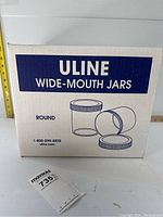 Box of Uline Wide-Mouth Jars front view with branding and illustration of jars with lids
