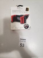 Photo of the brand-new Kouro Ugrip swivel air vent car phone holder in its original packaging, black and red design with box showing product features.