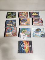 Photo showing ten dance music CDs in jewel cases arranged in two rows. Includes volumes from 'The Best of Dance Mix' series and one titled 'DJs United'.