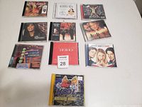 Overview of 10 movie soundtrack CDs arranged in a grid display on a white surface.