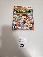 Photo of the game case for 'New Carnival Games' for the Wii system showing front cover with vibrant carnival-themed graphics and ESRB rating E.