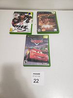 Three Xbox game cases displayed on white background with seller lot tag.