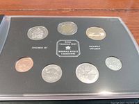 Seven Canadian coins dated 2000 displayed in a plastic holder with Royal Canadian Mint logo, from penny to two dollar coin.