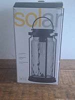 Photo of boxed solar lantern showing brand Soaked In Creativity and design