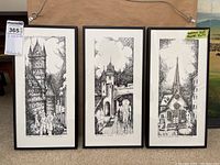 Three framed sketches arranged next to each other showing architectural scenes including Chateau Frontenac and a church steeple