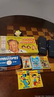 All vintage card games including All in the Family, Huckleberry Hound, Old Maid, Pinocchio, and Twin Flips card games, along with Radio Shack walkie talkies.